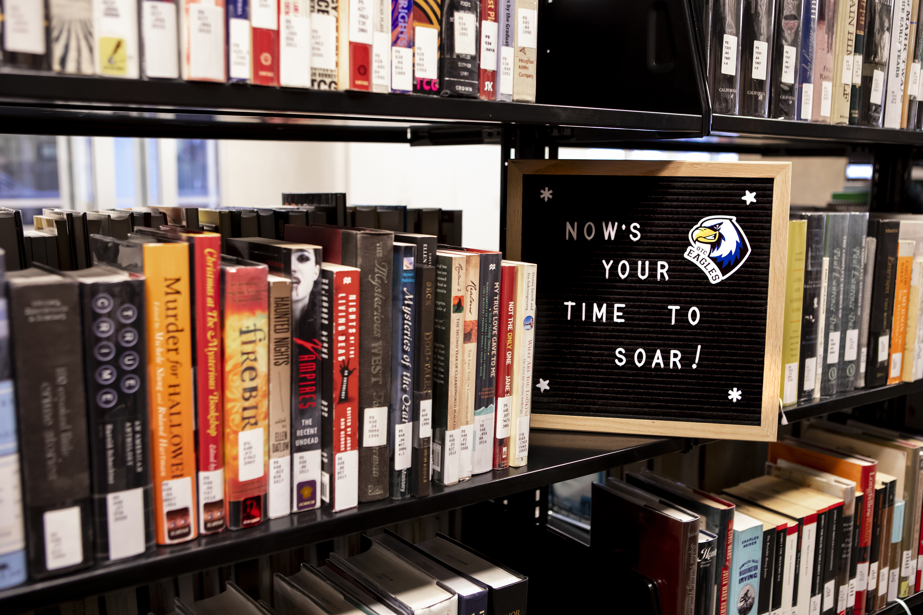 Message board on library shelf